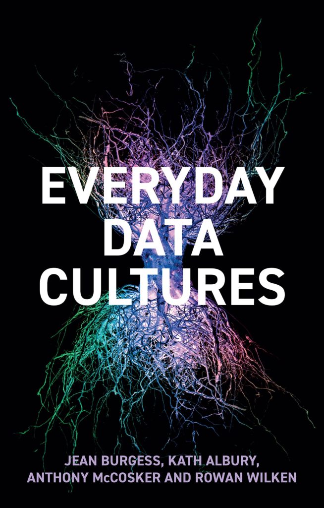 Cover image of Everyday Data Cultures, with bold white and lavender text over a multicoloured iridescent bundle of mushroom fibres